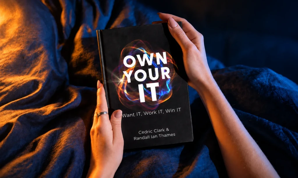 Hands holding the Own Your IT book